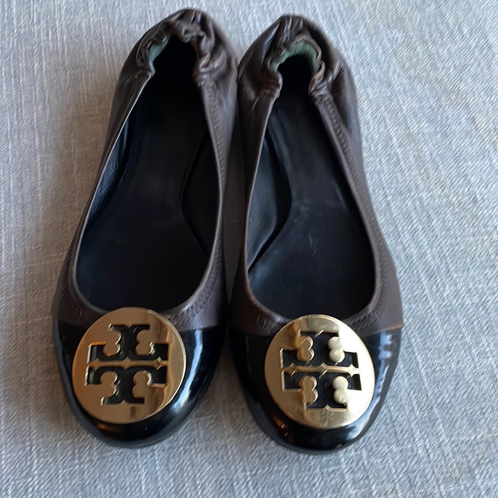 Tory Burch flats with black patent toe and gold embellished Tory logo